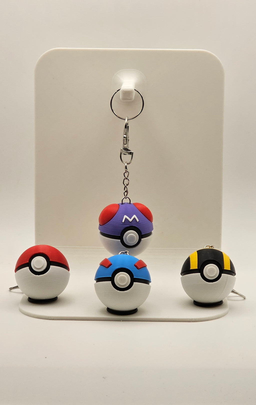 Set of four Pokéball fidget clickers