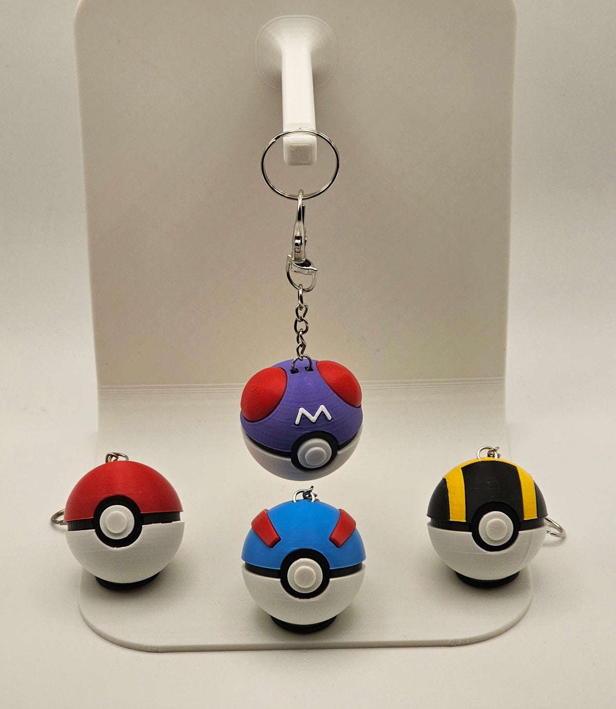 Set of four Pokéball fidget clickers